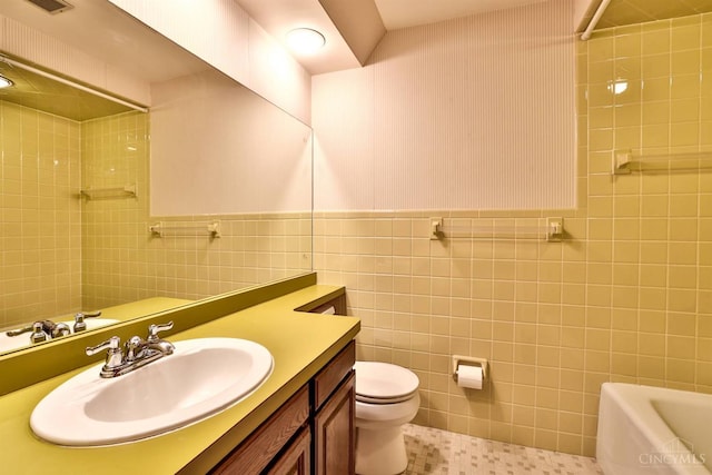 5868 Greenlawn Rd, Fairfield Twp, OH 45011 - bathroom featuring tile walls, vanity, a shower, a bath, and wainscoting