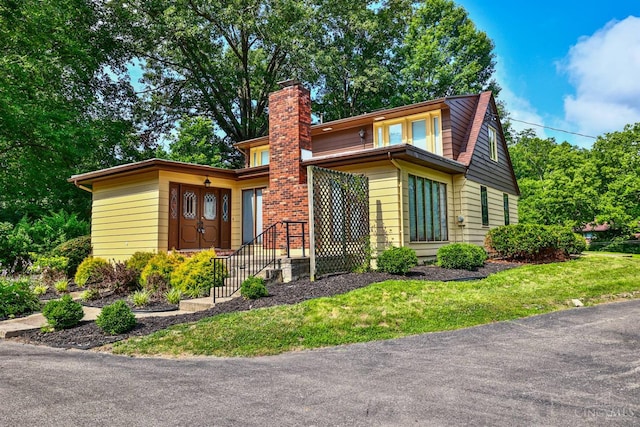 5868 Greenlawn Rd, Fairfield Twp, OH 45011 - view of front of home with a chimney and a front lawn