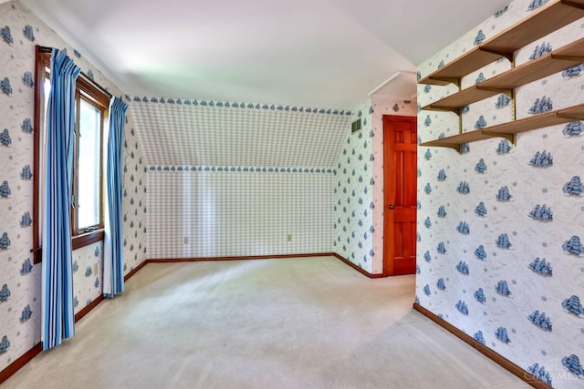 5868 Greenlawn Rd, Fairfield Twp, OH 45011 - unfurnished room with carpet, wallpapered walls, and lofted ceiling
