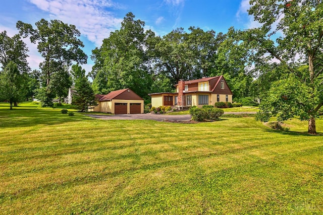 5868 Greenlawn Rd, Fairfield Twp, OH 45011 - view of front of house with an outdoor structure, a front lawn, a chimney, and a detached garage