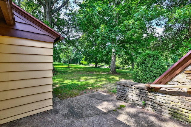 5868 Greenlawn Rd, Fairfield Twp, OH 45011 - view of grassy yard featuring a patio and view of wooded area