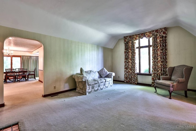 5868 Greenlawn Rd, Fairfield Twp, OH 45011 - sitting room with lofted ceiling, carpet flooring, and a chandelier