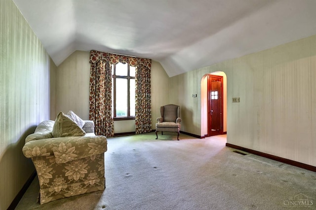 5868 Greenlawn Rd, Fairfield Twp, OH 45011 - living area featuring arched walkways, lofted ceiling, and carpet flooring