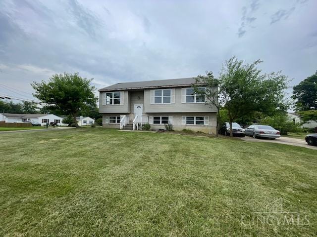 7774 School Rd, Sycamore Twp, OH 45249 - raised ranch featuring a front lawn