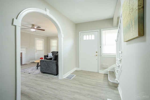 1744 Northampton Dr, Cincinnati, OH 45237 - foyer featuring arched walkways, light wood-type flooring, and ceiling fan