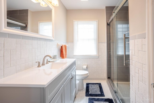 1744 Northampton Dr, Cincinnati, OH 45237 - bathroom with tile walls, vanity, a shower stall, tile patterned floors, and a wainscoted wall