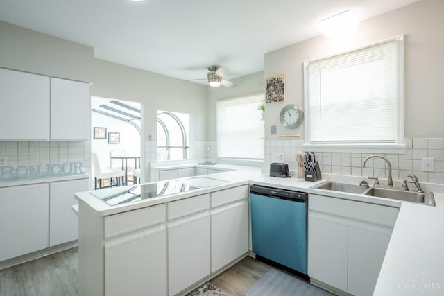 1744 Northampton Dr, Cincinnati, OH 45237 - kitchen featuring dishwashing machine, backsplash, electric cooktop, light wood-style floors, and light countertops