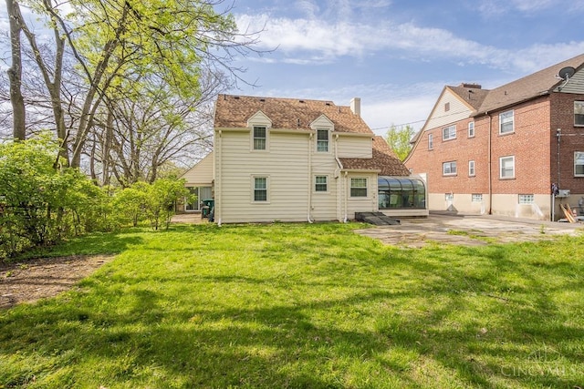 1744 Northampton Dr, Cincinnati, OH 45237 - rear view of property with a patio and a yard