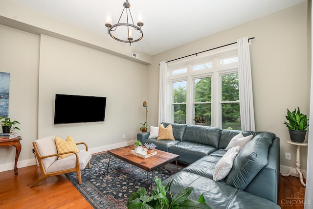 2100 Sinton Ave Unit 2, Cincinnati, OH 45206 - living room featuring a chandelier and wood finished floors