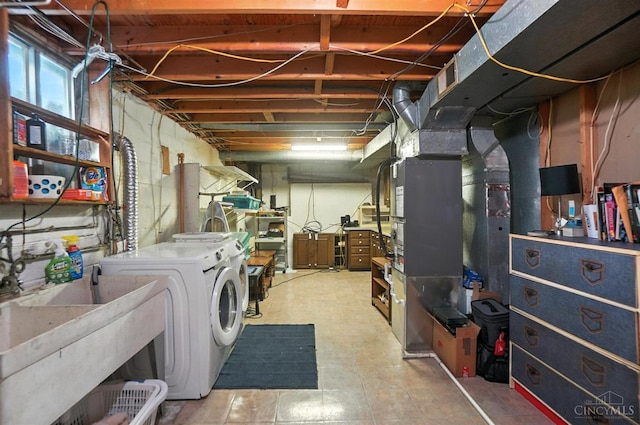 1092 Fox Run Rd, Miami Twp, OH 45150 - below grade area with washer and clothes dryer and a sink