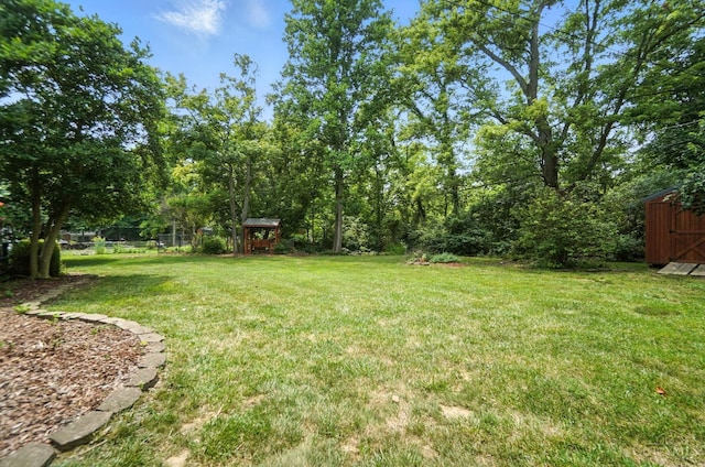 1092 Fox Run Rd, Miami Twp, OH 45150 - view of grassy yard with a storage shed