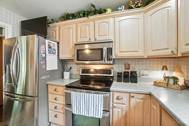 1092 Fox Run Rd, Miami Twp, OH 45150 - kitchen featuring stainless steel appliances, light brown cabinets, tasteful backsplash, and light countertops