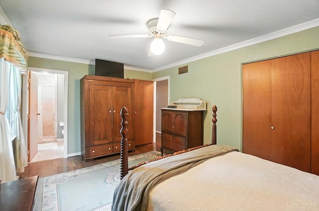1092 Fox Run Rd, Miami Twp, OH 45150 - bedroom with wood finished floors, ornamental molding, a ceiling fan, a closet, and ensuite bath