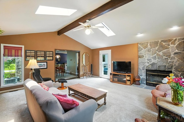 1092 Fox Run Rd, Miami Twp, OH 45150 - living room with a skylight, carpet, a stone fireplace, and plenty of natural light