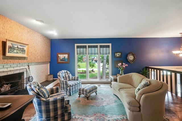 1092 Fox Run Rd, Miami Twp, OH 45150 - living area with a chandelier, a fireplace, and an accent wall