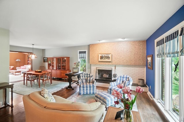 1092 Fox Run Rd, Miami Twp, OH 45150 - living room featuring dark wood-style flooring and a brick fireplace