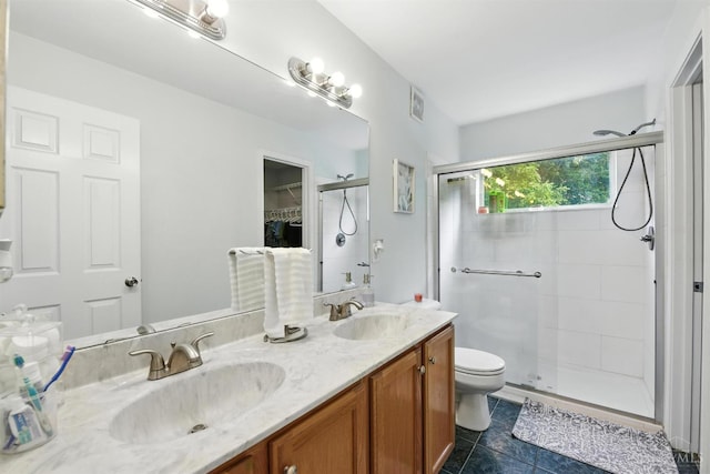 8538 Sunmont Dr, Anderson Twp, OH 45255 - full bath featuring a stall shower, double vanity, and tile patterned floors