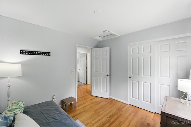 8538 Sunmont Dr, Anderson Twp, OH 45255 - bedroom featuring light wood-style floors, a closet, and attic access