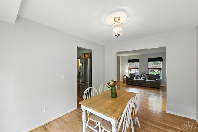 8538 Sunmont Dr, Anderson Twp, OH 45255 - dining area with light wood-style floors and baseboards