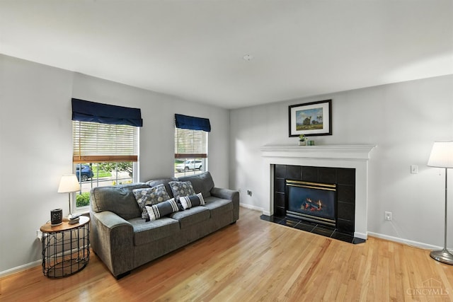 8538 Sunmont Dr, Anderson Twp, OH 45255 - living room featuring wood finished floors and a tile fireplace