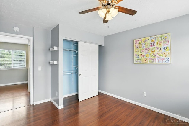 2317 Garrison Dr, Springfield Twp, OH 45231 - unfurnished bedroom featuring wood finished floors, a closet, and a ceiling fan