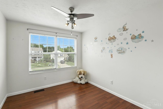 2317 Garrison Dr, Springfield Twp, OH 45231 - unfurnished room with a ceiling fan, wood finished floors, and a textured ceiling