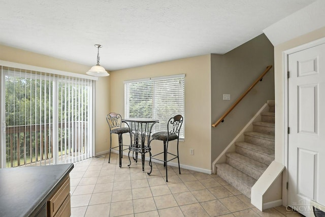 2317 Garrison Dr, Springfield Twp, OH 45231 - dining space featuring stairway and light tile patterned flooring