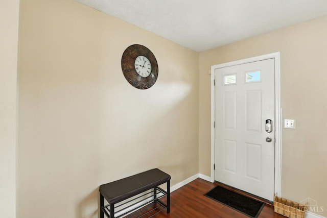 2317 Garrison Dr, Springfield Twp, OH 45231 - foyer entrance featuring dark wood-style floors and baseboards