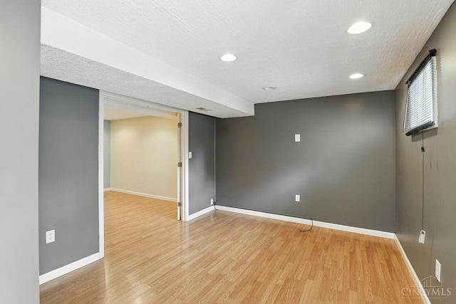 2317 Garrison Dr, Springfield Twp, OH 45231 - empty room with light wood-style flooring, recessed lighting, and a textured ceiling