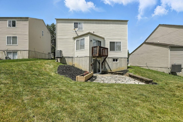 2317 Garrison Dr, Springfield Twp, OH 45231 - rear view of house with a lawn and a patio