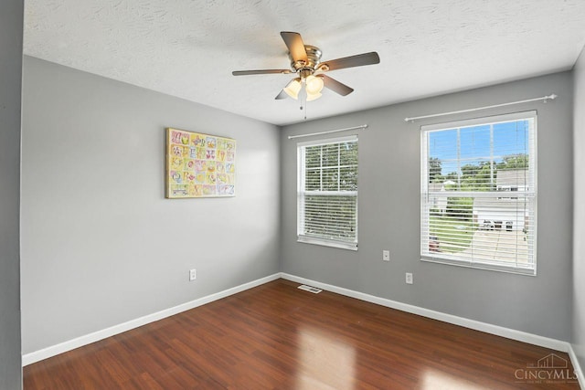2317 Garrison Dr, Springfield Twp, OH 45231 - unfurnished room with ceiling fan, dark wood finished floors, and a textured ceiling