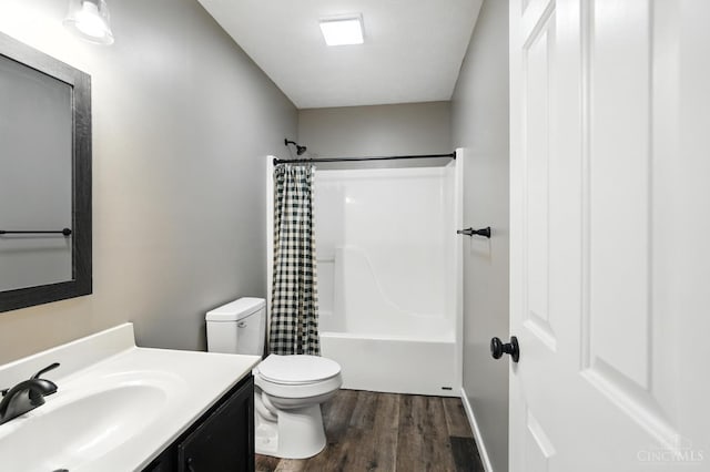 8939 Perry Ave, Franklin, OH 45005 - full bath with vanity, wood finished floors, and shower / bath combination with curtain