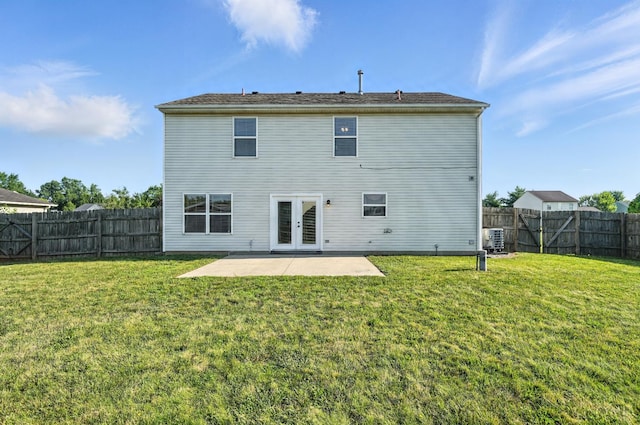 8939 Perry Ave, Franklin, OH 45005 - back of property with french doors, a patio, and a fenced backyard