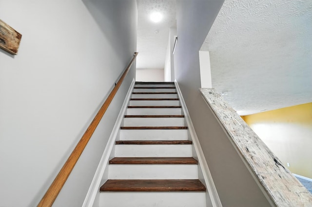 8939 Perry Ave, Franklin, OH 45005 - staircase with a textured ceiling