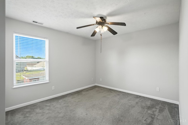 8939 Perry Ave, Franklin, OH 45005 - carpeted spare room featuring a ceiling fan and a textured ceiling