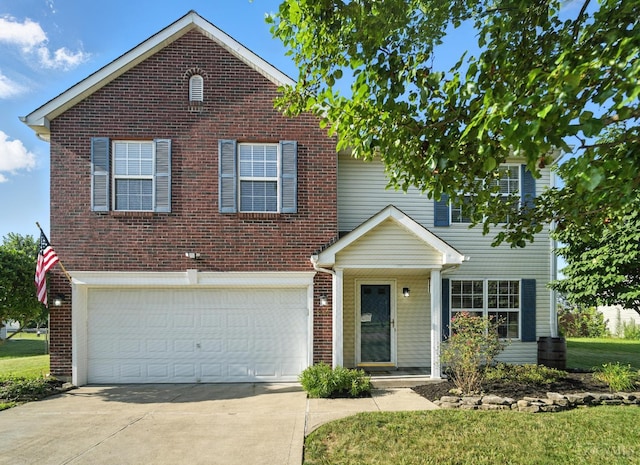 8939 Perry Ave, Franklin, OH 45005 - traditional home with brick siding, concrete driveway, and a garage