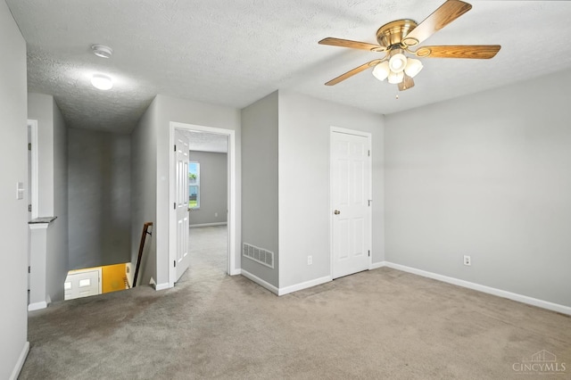 8939 Perry Ave, Franklin, OH 45005 - carpeted empty room with a ceiling fan, a smoke detector, and a textured ceiling