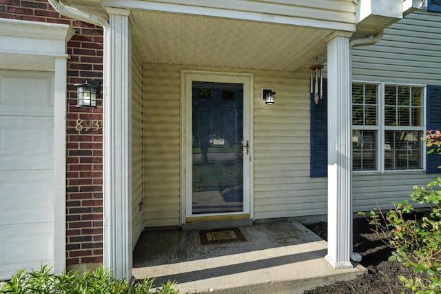 8939 Perry Ave, Franklin, OH 45005 - doorway to property with brick siding and a garage