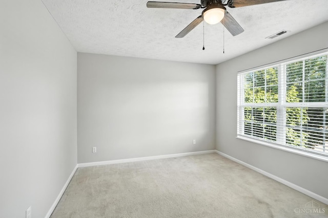 8939 Perry Ave, Franklin, OH 45005 - spare room featuring light colored carpet, a textured ceiling, and a ceiling fan