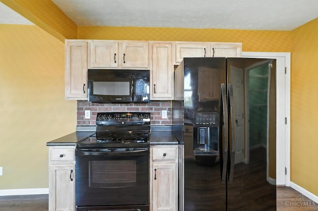 8939 Perry Ave, Franklin, OH 45005 - kitchen featuring black appliances, dark countertops, dark wood-style flooring, and backsplash