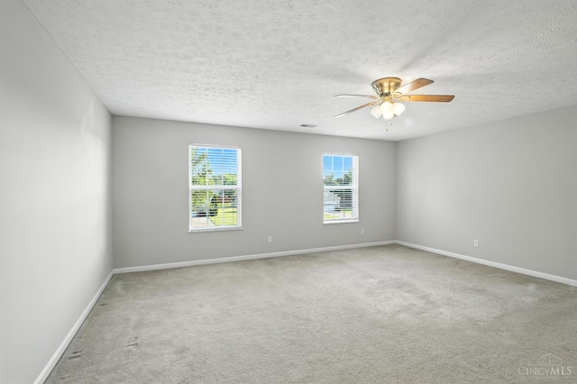 8939 Perry Ave, Franklin, OH 45005 - empty room featuring carpet, ceiling fan, and a textured ceiling