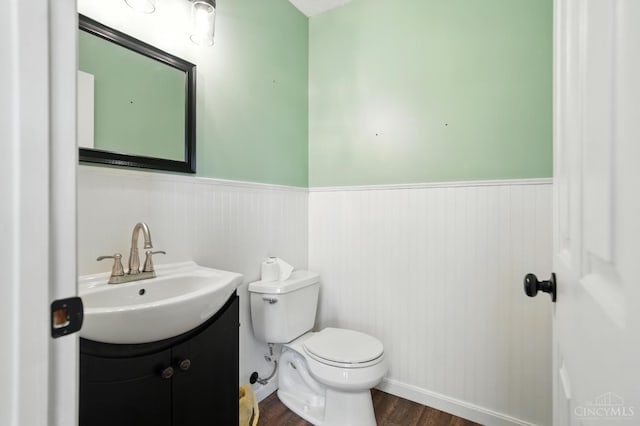 8939 Perry Ave, Franklin, OH 45005 - bathroom with vanity, wood finished floors, and wainscoting