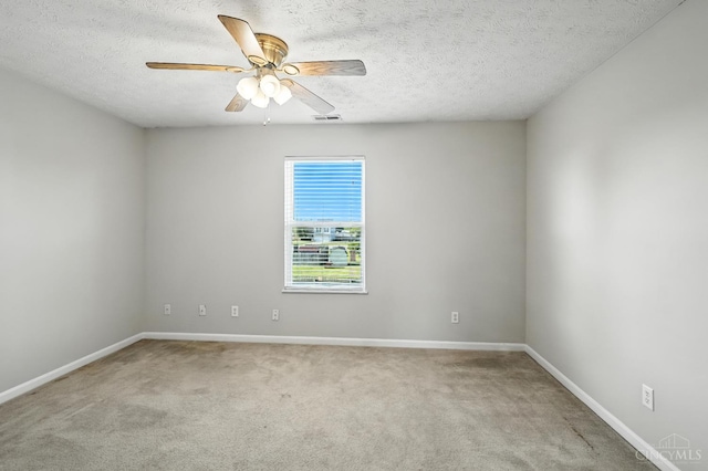 8939 Perry Ave, Franklin, OH 45005 - spare room featuring light carpet, a ceiling fan, and a textured ceiling