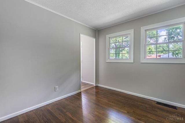 3803 Hampton Pl, Middletown, OH 45042 - empty room featuring wood finished floors, crown molding, and a textured ceiling