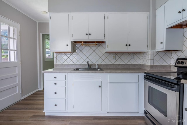 3803 Hampton Pl, Middletown, OH 45042 - kitchen with stainless steel electric range, white cabinets, decorative backsplash, crown molding, and light countertops
