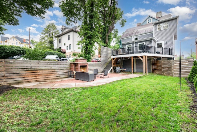 1117 Cypress St, Cincinnati, OH 45206 - back of property with an outdoor stone fireplace, a deck, a patio, a chimney, and stairs