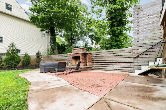 1117 Cypress St, Cincinnati, OH 45206 - fenced backyard featuring an outdoor brick fireplace and a patio