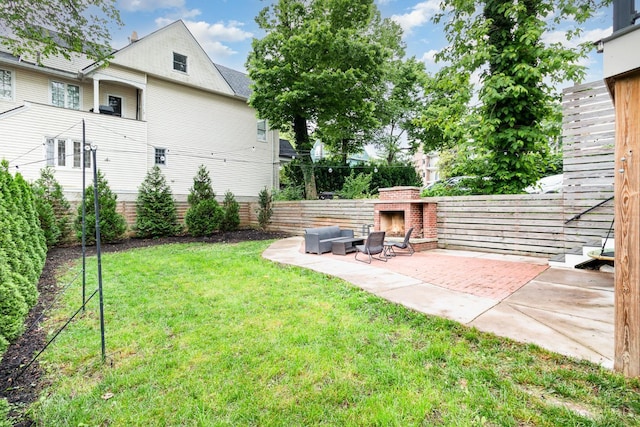 1117 Cypress St, Cincinnati, OH 45206 - view of yard with a lit fireplace and a patio