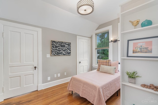 1117 Cypress St, Cincinnati, OH 45206 - bedroom with vaulted ceiling and wood finished floors