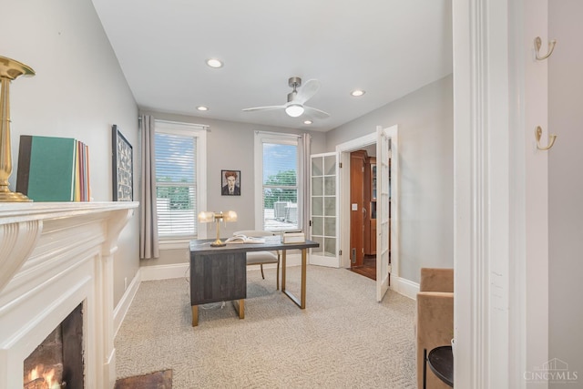 1117 Cypress St, Cincinnati, OH 45206 - home office featuring light colored carpet, recessed lighting, ceiling fan, and a warm lit fireplace